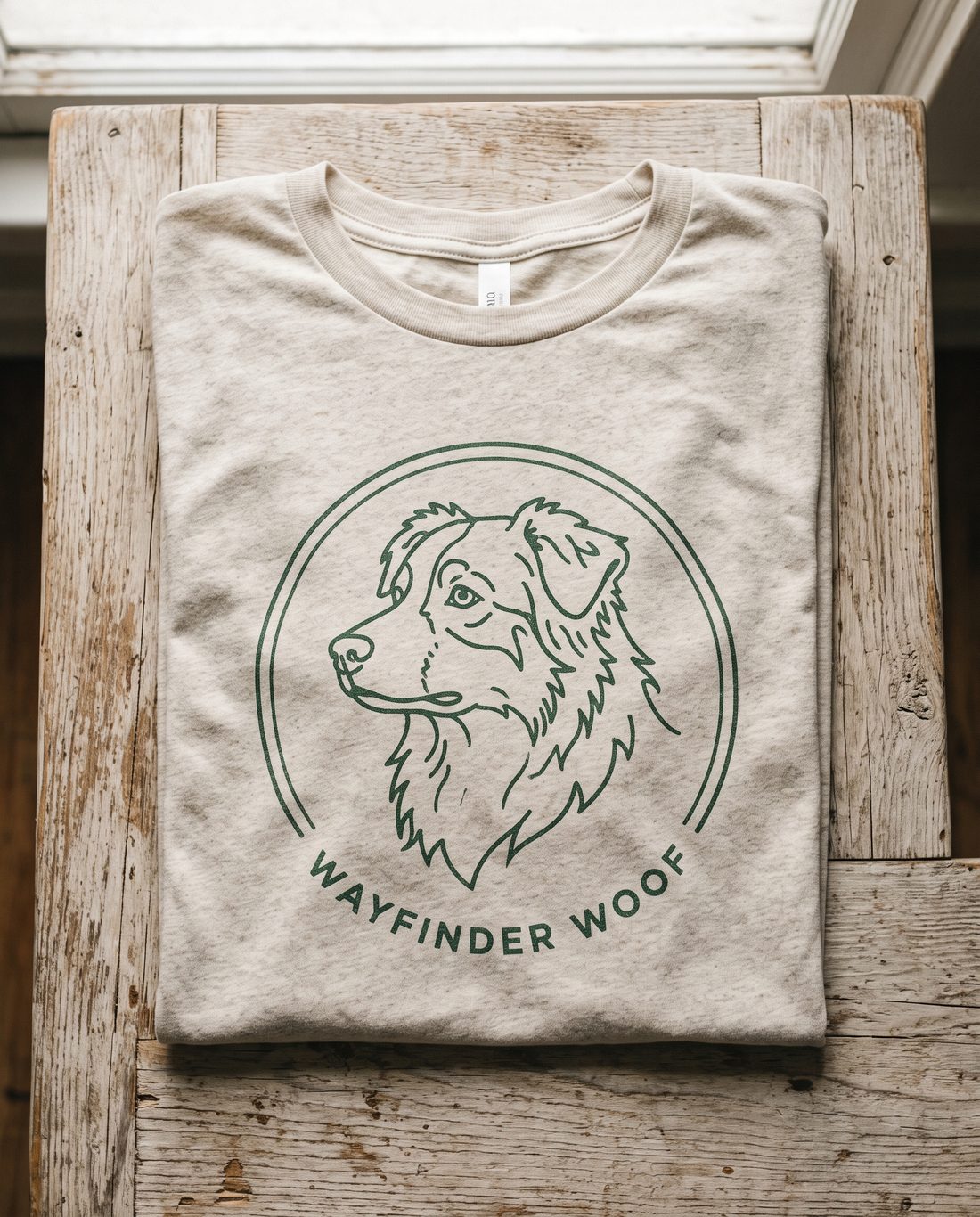 Heather oatmeal tee with an Australian Shepherd badge print